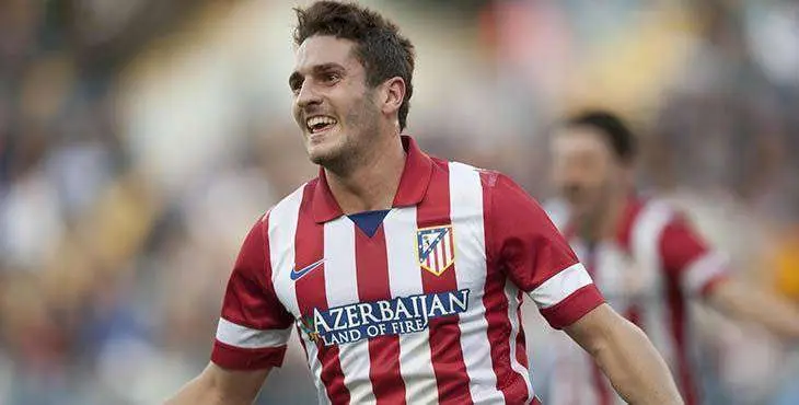Atletico de Madrid's Jorge Resurreccion "Koke" celebrates his goal during a Spanish La Liga soccer match between Malaga and Atletico de Madrid at the La Rosaleda stadium in Malaga, Spain, Saturday, Jan. 4, 2014. (AP Photo/Daniel Tejedor)