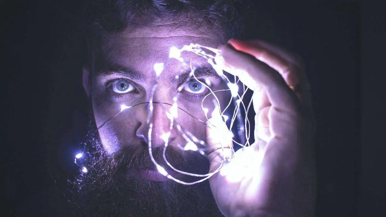  person-holding-string-lights-photo-818563 