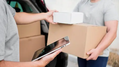 close-up-delivery-man-with-boxes